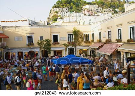 Stock Image - Tourists at sidewalk cafes, Capri, Campania, Italy. Fotosearch