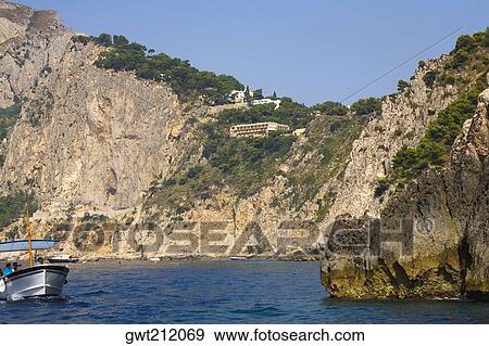 Tourists in a boat, Capri, Campania, Italy View Large Photo Image Stock Photo - Tourists in a boat, Capri, Campania, Italy. Fotosearch