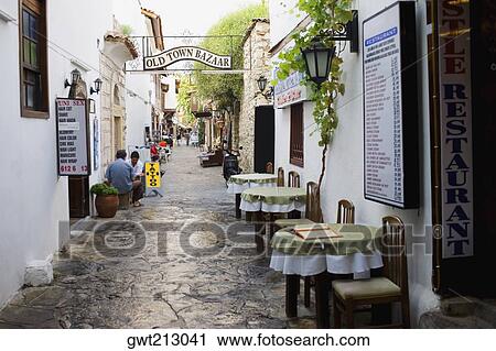 Empty chairs and tables in front of a restaurant in a street, Ephesus, Turkey View Large Photo Image Stock Image - Empty chairs and tables in front of a restaurant in a street, Ephesus, Turkey. Fotosearch