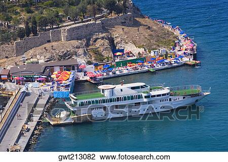 Stock Image - High angle view of a cruise ship moored at a harbor on an island, Ephesus, Turkey. Fotosearch