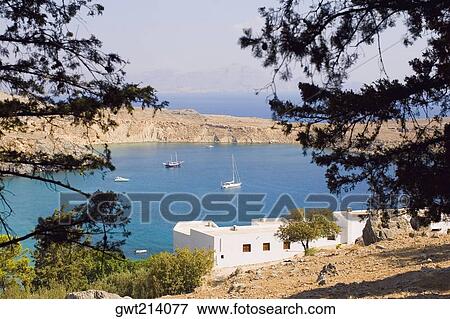 Stock Photo - Buildings along the sea, Rhodes, Dodecanese Islands, Greece. Fotosearch