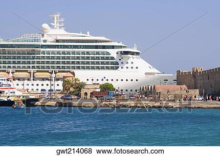 Stock Photo - Cruise ship at a harbor, Mandraki Harbor, Rhodes, Dodecanese Islands, Greece. Fotosearch