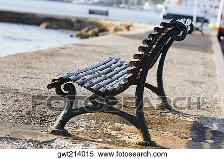 Empty bench at the seaside, Rhodes, Dodecanese Islands, Greece View Large Photo Image Stock Photography - Empty bench at the seaside, Rhodes, Dodecanese Islands, Greece. Fotosearch