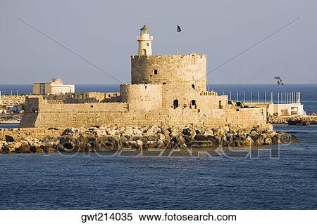 Stock Photography - Fortress in the sea, Mandraki Harbor, Rhodes, Dodecanese Islands, Greece. Fotosearch
