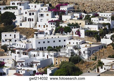 High angle view of buildings in a town, Lindos, Rhodes, Dodecanese Islands, Greece View Large Photo Image Stock Image - High angle view of buildings in a town, Lindos, Rhodes, Dodecanese Islands, Greece. Fotosearch