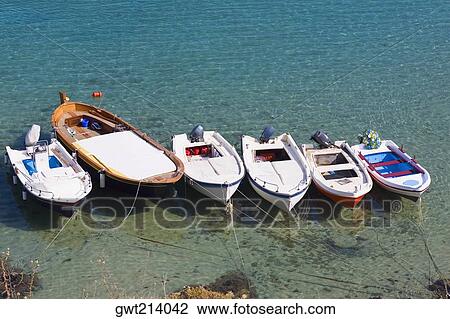Stock Image - High angle view of motor boats moored in the sea, Rhodes, Dodecanese Islands, Greece. Fotosearch