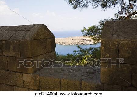Old ruins of a fortified wall, Rhodes, Dodecanese Islands, Greece View Large Photo Image Picture - Old ruins of a fortified wall, Rhodes, Dodecanese Islands, Greece. Fotosearch