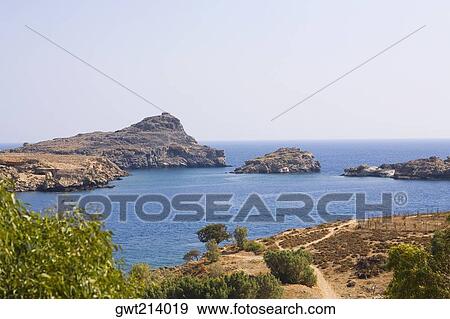 Stock Photo - Rock formations in the sea, Rhodes, Dodecanese Islands, Greece. Fotosearch
