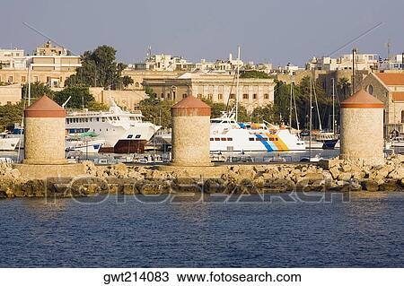 Windmills on the harbor, Mandraki Harbor, Rhodes, Dodecanese Islands, Greece View Large Photo Image Stock Image - Windmills on the harbor, Mandraki Harbor, Rhodes, Dodecanese Islands, Greece. Fotosearch
