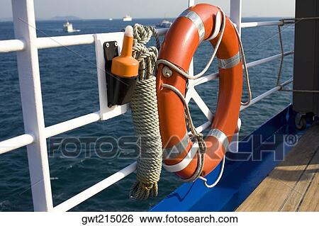 Life belt tied on the railing of a boat, Athens, Greece View Large Photo Image Stock Photograph - Life belt tied on the railing of a boat, Athens, Greece. Fotosearch