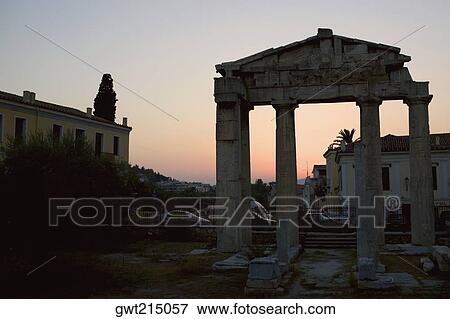 Stock Photo - Old ruins in front of buildings, Roman Agora, Athens, Greece. Fotosearch