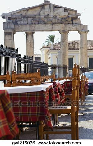 Stock Photograph - Sidewalk cafe in front of the old ruins, Roman Agora, Athens, Greece. Fotosearch