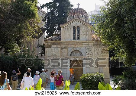 Stock Photography - Tourists in front of a church, Panagia Gorgoepikoos, Athens, Greece. Fotosearch