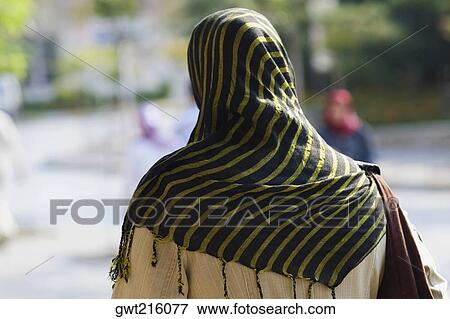 Stock Photo - Rear view of a person wearing a headscarf, Istanbul, Turkey. Fotosearch