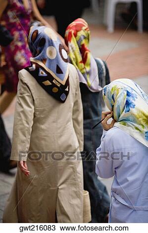 Rear view of three women walking, Istanbul, Turkey View Large Photo Image Stock Image - Rear view of three women walking, Istanbul, Turkey. Fotosearch