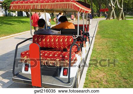 Rear view of two men sitting in a cart, Istanbul, Turkey View Large Photo Image Stock Photography - Rear view of two men sitting in a cart, Istanbul, Turkey. Fotosearch