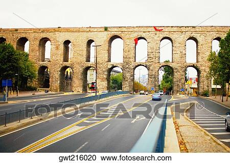 Traffic passing under an aqueduct, Valens Aqueduct, Istanbul, Turkey View Large Photo Image Stock Image - Traffic passing under an aqueduct, Valens Aqueduct, Istanbul, Turkey. Fotosearch