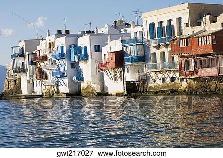 Buildings at the waterfront, Mykonos Town, Mykonos, Cyclades Islands, Greece View Large Photo Image Stock Photo - Buildings at the waterfront, Mykonos Town, Mykonos, Cyclades Islands, Greece. Fotosearch
