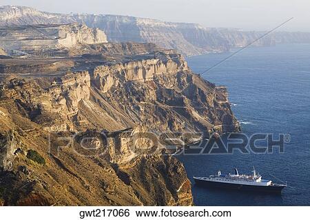 Cliffs along the sea, Santorini, Cyclades Islands, Greece View Large Photo Image Stock Photograph - Cliffs along the sea, Santorini, Cyclades Islands, Greece. Fotosearch