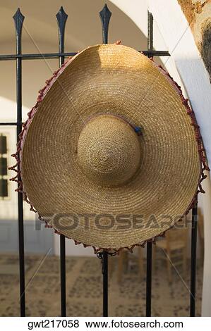 Close-up of a straw hat on a metal fence, Greece View Large Photo Image Stock Photo - Close-up of a straw hat on a metal fence, Greece. Fotosearch