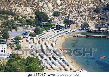High angle view of a beach, Lindos, Rhodes, Dodecanese Islands, Greece View Large Photo Image Stock Photo - High angle view of a beach, Lindos, Rhodes, Dodecanese Islands, Greece. Fotosearch