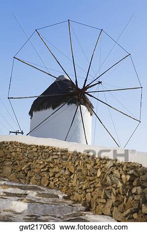 Stock Image - Low angle view of a traditional windmill, Mykonos, Cyclades Islands, Greece. Fotosearch