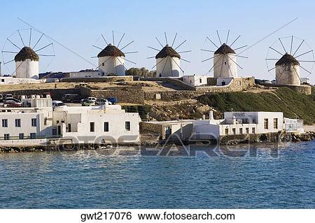 Traditional windmills in a row, Mykonos, Cyclades Islands, Greece View Large Photo Image Stock Photograph - Traditional windmills in a row, Mykonos, Cyclades Islands, Greece. Fotosearch