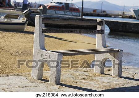 Bench on the beach, Mykonos, Cyclades Islands, Greece View Large Photo Image Picture - Bench on the beach, Mykonos, Cyclades Islands, Greece. Fotosearch