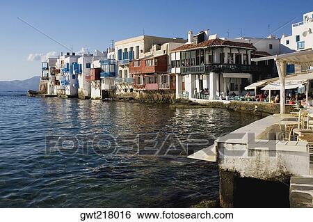 Buildings at the waterfront, Mykonos, Cyclades Islands, Greece View Large Photo Image Stock Photograph - Buildings at the waterfront, Mykonos, Cyclades Islands, Greece. Fotosearch