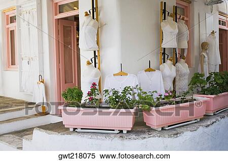 Clothes displayed on mannequins outside of a clothing store, Mykonos, Cyclades Islands, Greece View Large Photo Image Stock Photography - Clothes displayed on mannequins outside of a clothing store, Mykonos, Cyclades Islands, Greece. Fotosearch