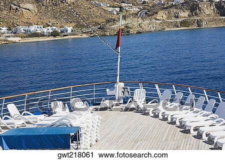 Deck chairs on boat deck, Mykonos, Cyclades Islands, Greece View Large Photo Image Stock Image - Deck chairs on boat deck, Mykonos, Cyclades Islands, Greece. Fotosearch
