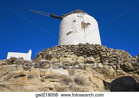 Stock Photograph - Low angle view of a traditional windmill, Mykonos, Cyclades Islands, Greece. Fotosearch