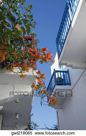 Stock Photography - Low angle view of two balconies of a building, Mykonos, Cyclades Islands, Greece. Fotosearch