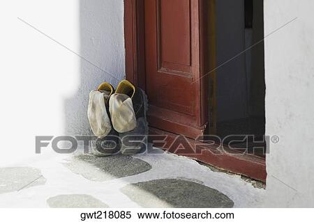 Pair of shoes at a door, Mykonos, Cyclades Islands, Greece View Large Photo Image Stock Photography - Pair of shoes at a door, Mykonos, Cyclades Islands, Greece. Fotosearch