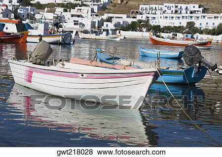 Reflection of boats in the sea, Mykonos, Cyclades Islands, Greece View Large Photo Image Stock Photo - Reflection of boats in the sea, Mykonos, Cyclades Islands, Greece. Fotosearch