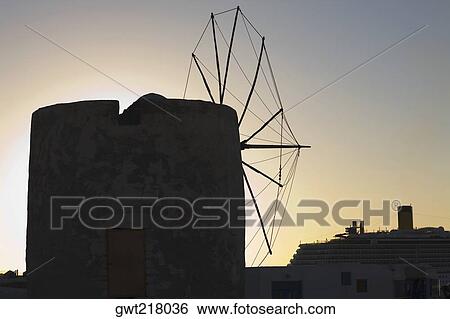 Silhouette of a traditional windmill, Mykonos, Cyclades Islands, Greece View Large Photo Image Stock Photograph - Silhouette of a traditional windmill, Mykonos, Cyclades Islands, Greece. Fotosearch