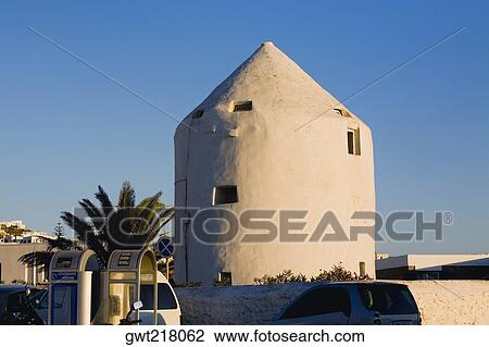 Traditional windmill in a town, Mykonos, Cyclades Islands, Greece View Large Photo Image Stock Image - Traditional windmill in a town, Mykonos, Cyclades Islands, Greece. Fotosearch