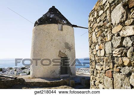 Traditional windmill on the coast, Mykonos, Cyclades Islands, Greece View Large Photo Image Picture - Traditional windmill on the coast, Mykonos, Cyclades Islands, Greece. Fotosearch