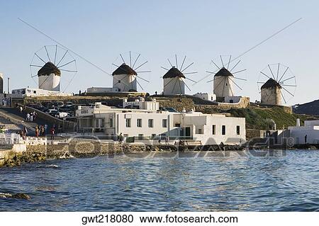 Traditional windmills in a row, Mykonos, Cyclades Islands, Greece View Large Photo Image Stock Image - Traditional windmills in a row, Mykonos, Cyclades Islands, Greece. Fotosearch