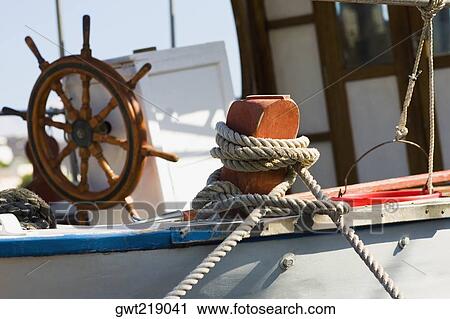 Boat tied up with a rope, Patmos, Dodecanese Islands, Greece View Large Photo Image Stock Image - Boat tied up with a rope, Patmos, Dodecanese Islands, Greece. Fotosearch