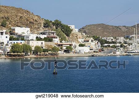 Stock Photo - Buildings at the waterfront, Patmos, Dodecanese Islands, Greece. Fotosearch
