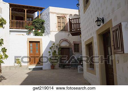 Courtyard of buildings, Patmos, Dodecanese Islands, Greece View Large Photo Image Picture - Courtyard of buildings, Patmos, Dodecanese Islands, Greece. Fotosearch