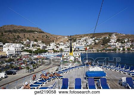 High angle view of lounge chairs on the deck of a ship, Skala, Patmos, Dodecanese Islands, Greece View Large Photo Image Stock Photo - High angle view of lounge chairs on the deck of a ship, Skala, Patmos, Dodecanese Islands, Greece. Fotosearch