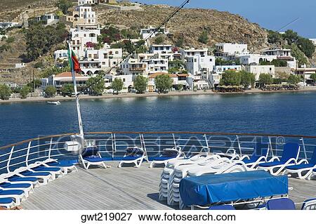 Lounge chairs on the deck of a ship, Patmos, Dodecanese Islands, Greece View Large Photo Image Stock Photo - Lounge chairs on the deck of a ship, Patmos, Dodecanese Islands, Greece. Fotosearch
