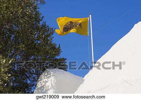 Low angle view of a flag over a monastery, Monastery of the Apocalypse, Patmos, Dodecanese Islands, Greece View Large Photo Image Stock Photo - Low angle view of a flag over a monastery, Monastery of the Apocalypse, Patmos, Dodecanese Islands, Greece. Fotosearch