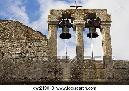 Stock Image - Low angle view of bells of a church, Patmos, Dodecanese Islands, Greece. Fotosearch