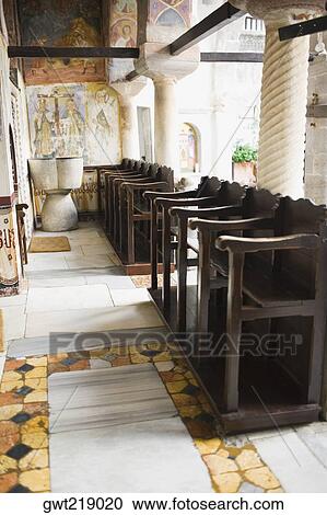 Stock Image - Pews in a church, Monastery of St. John the Divine, Patmos, Dodecanese Islands, Greece. Fotosearch