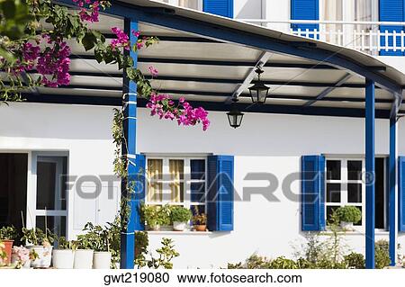 Potted plants in front of a building, Patmos, Dodecanese Islands, Greece View Large Photo Image Stock Image - Potted plants in front of a building, Patmos, Dodecanese Islands, Greece. Fotosearch