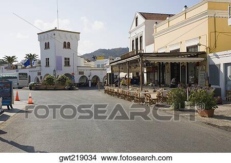 Picture - Sidewalk cafe at the roadside, Patmos, Dodecanese Islands, Greece. Fotosearch