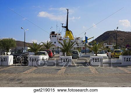 Taxi at a taxi stand in a city, Patmos, Dodecanese Islands, Greece View Large Photo Image Stock Photography - Taxi at a taxi stand in a city, Patmos, Dodecanese Islands, Greece. Fotosearch